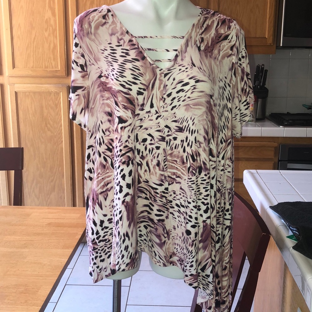 Fun blouse!  Longer on one side